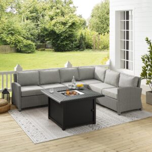 Relax by the warmth of the fire with the Bradenton 5pc Wicker Sectional Set. Sectional seating for up to six surrounds the powder-coated steel fire table offering deep seats on all-weather resin wicker. The sectional cushions are covered in a solution-dyed polyester for durability and comfort. The fire table's slatted top and solid paneled base offer a simple design that blends with a variety of outdoor spaces. The gas controls and a rack for a propane tank are located inside the table's base