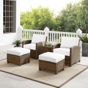 Kick back and prop up your feet with the Bradenton 5pc Outdoor Chair Set. Both the chairs and ottomans have sturdy steel frames wrapped in beautiful all-weather wicker. Enjoy the look of bright white outdoor cushions worry-free. Featuring thick cushions covered in high-quality Sunbrella fabric