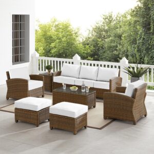 Spend warm sunny days and cool autumn nights with the Bradenton 7Pc Sofa Set. Each piece of the set has a sturdy steel frame covered in all-weather resin wicker. Enjoy the look of bright white outdoor cushions worry-free. Featuring thick cushions covered in high-quality Sunbrella fabric
