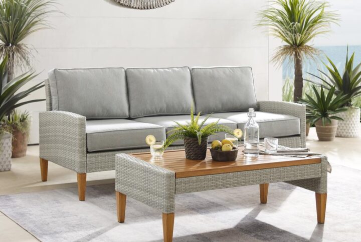 Bring coastal swagger to outdoor relaxation with the Capella 2pc Sofa Set. Blending cool neutral tones with natural finishes
