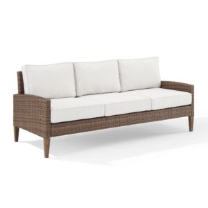 the Capella Outdoor Sofa brings coastal swagger to your outdoor space. Ideal for lounging solo or shooting the breeze with friends