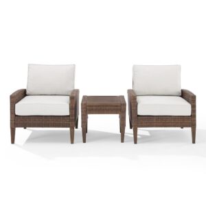 this patio set features all-weather resin wicker and hand-painted steel with a natural wood look. Beautiful quick-drying olefin fabric adds durability to the cushioned chairs
