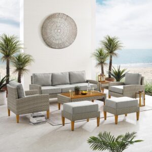 this set features all-weather resin wicker and hand-painted steel with a natural wood look. Beautiful quick-drying olefin fabric adds durability to the cushioned seating and ottomans