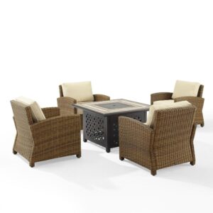 Gather around the fire for a relaxing evening with the Bradenton 5pc Conversation Set. Four all-weather resin wicker armchairs surround a powder-coated steel fire table