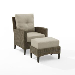 this patio set is built from all-weather resin wicker handwoven over a powder-coated steel frame. The chair and ottoman cushions are covered in moisture-resistant olefin fabric. Each piece features unique tapered legs made of sturdy steel that is hand-painted to look like real wood. Prop up your feet and relax in the comfort and durability of the Rockport patio chair set.