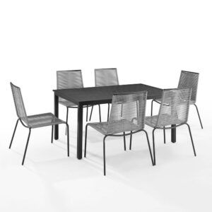 Featuring six armless chairs and a rectangular dining table