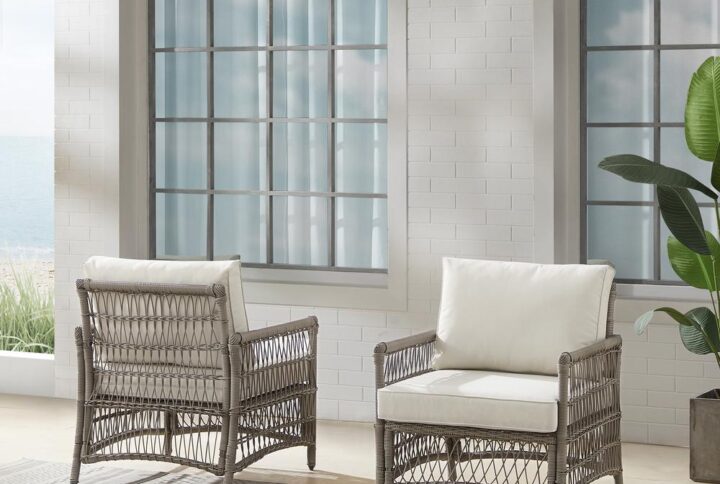 Create the look of an island retreat with the Thatcher Patio Chairs (Set of 2). Featuring sturdy steel frames wrapped in beautiful all-weather resin wicker