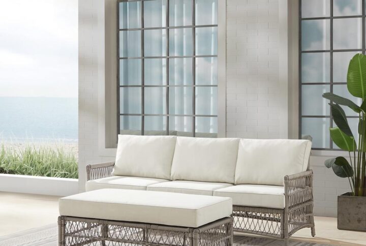 Create the look of an island retreat with the Thatcher 2pc Sofa Set. This set features sturdy steel frames wrapped in beautiful all-weather resin wicker and thick weather-resistant cushions. The coffee table ottoman is designed with versatility in mind. Add extra seating or prop up your feet with the included cushion