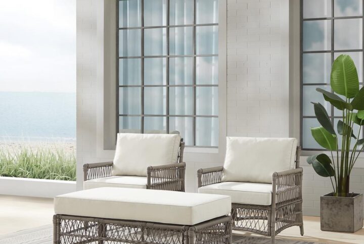 Create the look of an island retreat with the Thatcher 3pc Outdoor Chair Set. This patio set features sturdy steel frames wrapped in beautiful all-weather resin wicker and thick weather-resistant cushions. The coffee table ottoman is designed with versatility in mind. Add extra seating or prop up your feet with the included cushion