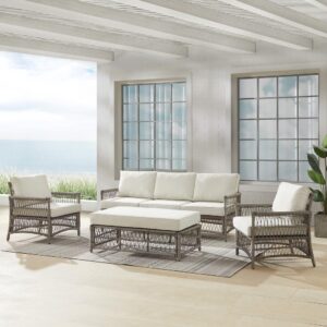 Create the look of an island retreat with the Thatcher 4pc Sofa Set. This set features sturdy steel frames wrapped in beautiful all-weather resin wicker and thick weather-resistant cushions. The coffee table ottoman is designed with versatility in mind. Add extra seating or prop up your feet with the included cushion