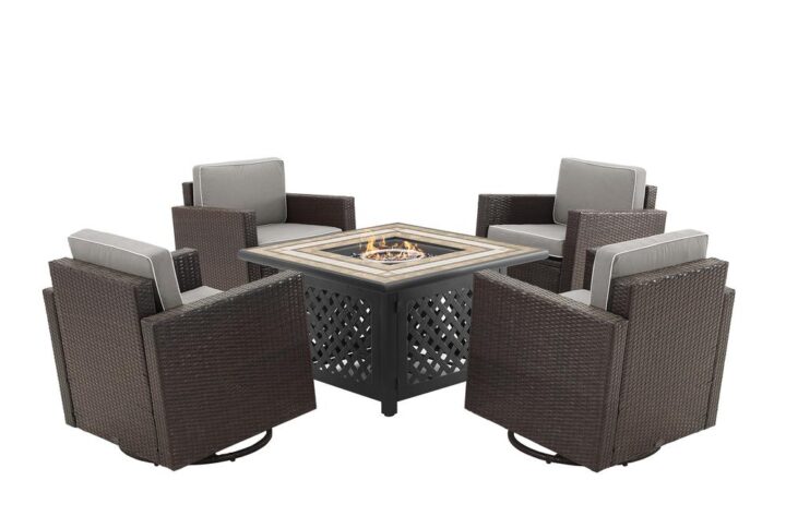 Enjoy an evening around the fire with the Palm Harbor 5pc Conversation Set. Each swivel rocker features a durable steel frame covered in all-weather resin wicker