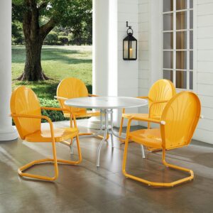 the dining table partners with four classic Griffith chairs. Each chair has a vintage style that comes in a variety of vibrant colors. The chairs cantilever base offer just enough flex for lounging in comfort. The simple dining table has a sturdy pedestal base that that allows the stunning Griffith chairs to shine.