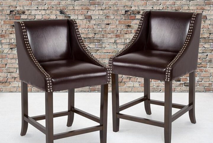 Bring warmth and comfort to your home while adding some world class elegance with this set of 2 classically sophisticated brown counter stools. Have breakfast at your kitchen island or hang out with friends around the dining room table in style. Boasting soft and durable LeatherSoft upholstery paired with decorative nail head trim
