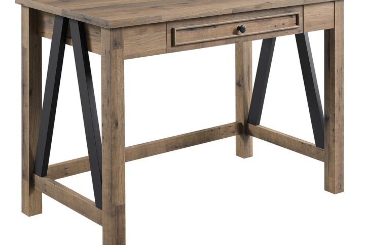 The Quinton Desk offers rustic style that will beautifully elevate any home décor.  This ample writing desk features convenient yet concealed power with both AC plug-ins and dual USB ports cleverly tucked away in the top drawer. This large storage drawer keeps office supplies organized and devices out of sight. Attractive steel trestle accentuates the sturdy frame and rubbed bronze hardware paired with woodgrain surfaces completes the look. Upgrade