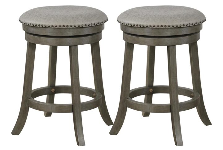 The Round Swivel Stool from OSP Home Furnishings is a nimble option for your home seating arrangements. Both swivel stools are made of solid wood. Each one having an attached footrest for comfort. Perfect for your guests while dining or just simply for fun! Don't you want more out of your chair? This swivel stool makes sitting down a unique experience.