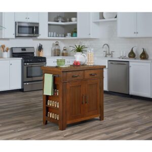 The Urban Farmhouse Kitchen Island Collection offers hints of a rustic farmhouse design along with updated urban touches. Constructed of solid hardwoods and engineered wood accented with industrial style hammered metal cabinet hardware. Features include