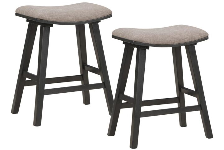Add comfort and style with our 24" counter height stools sold as a pair in convenient 2-pack. Padded saddle seat design offers comfortable sitting and exceptional visual appeal. Solid wood legs and 100% Polyester fabric seat will provide long lasting beauty and durability.