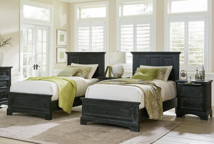 A transitional take on farmhouse design. The farmhouse basics twin bed collection will rejuvenate your home furnishings. This collection include two twin bed sets and two nightstands. The nightstands feature a laminated pull-out tray that keeps beverages safe and secure. In addition