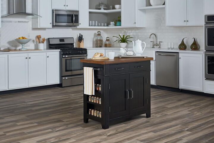 The Urban Farmhouse Kitchen Island Collection offers hints of a rustic farmhouse design along with updated urban touches. Constructed of solid hardwoods and engineered wood accented with industrial style hammered metal cabinet hardware. Features include