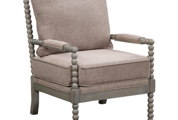 The Abbott Chair transforms the living room with a chic farmhouse design. The chair is characterized by its turned spindle detailing