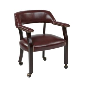 Traditional Guest Chair with Wrap Around Back and Casters. Thick Padded Seat and Back. Padded Armrest. Jamestown Oxblood Vinyl (-JT4). Mahogany Finish Wood Legs with Casters.