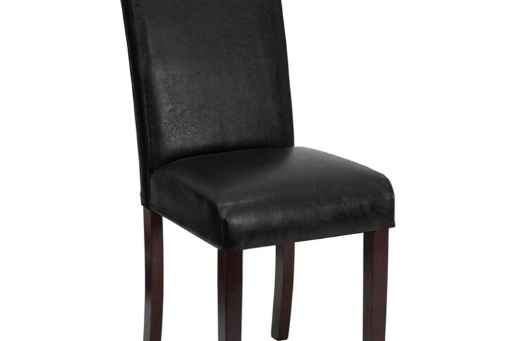 The classic design of this black LeatherSoft upholstered parsons chair makes it a versatile seating option for your home. Sleek lined panel stitching and mahogany frame finish make them beautiful while high density foam padding and solid hardwood frame construction make them comfortable and durable. Parsons chairs are versatile and can be used not only in the dining room and kitchen but also as a reading chair or extra seating in the living room. The armless design gives the illusion of space which makes them great for small spaces. Make quick work of spills with a water based cleaner. Skirted chair covers can be used to soften their lines for living rooms and bedrooms. A parsons chair can be both formal or casual and are designed to go with almost any decor.