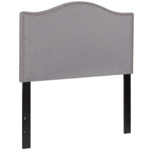 you need a headboard to provide extra support. A headboard gives your room a very personal touch and allows you to show off your style. This gorgeous light gray twin headboard features brass nailhead trim