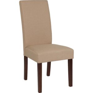 The classic design of this beige fabric upholstered parsons chair makes it a versatile seating option for your home. Sleek panel lined stitching and a mahogany frame finish make them beautiful while high density foam padding and solid hardwood frame construction make them comfortable and durable. Parsons chairs are versatile and can be used not only in the dining room and kitchen but also as a reading chair or extra seating in the living room. The armless design gives the illusion of space which makes them great for small spaces. Vacuum or brush lightly to remove soil. Skirted chair covers can be used to soften their lines for living rooms and bedrooms. A parsons chair can be both formal or casual and are designed to go with almost any decor.
