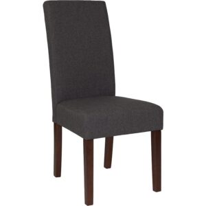 The classic design of this gray fabric upholstered parsons chair makes it a versatile seating option for your home. Sleek panel lined stitching and a mahogany frame finish make them beautiful while high density foam padding and solid hardwood frame construction make them comfortable and durable. Parsons chairs are versatile and can be used not only in the dining room and kitchen but also as a reading chair or extra seating in the living room. The armless design gives the illusion of space which makes them great for small spaces. Vacuum or brush lightly to remove soil. Skirted chair covers can be used to soften their lines for living rooms and bedrooms. A parsons chair can be both formal or casual and are designed to go with almost any decor.