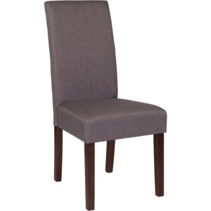 The classic design of this light gray fabric upholstered parsons chair makes it a versatile seating option for your home. Sleek panel lined stitching and a mahogany frame finish make them beautiful while high density foam padding and solid hardwood frame construction make them comfortable and durable. Parsons chairs are versatile and can be used not only in the dining room and kitchen but also as a reading chair or extra seating in the living room. The armless design gives the illusion of space which makes them great for small spaces. Vacuum or brush lightly to remove soil. Skirted chair covers can be used to soften their lines for living rooms and bedrooms. A parsons chair can be both formal or casual and are designed to go with almost any decor.