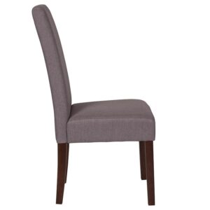 The classic design of this light gray fabric upholstered parsons chair makes it a versatile seating option for your home. Sleek panel lined stitching and a mahogany frame finish make them beautiful while high density foam padding and solid hardwood frame construction make them comfortable and durable. Parsons chairs are versatile and can be used not only in the dining room and kitchen but also as a reading chair or extra seating in the living room. The armless design gives the illusion of space which makes them great for small spaces. Vacuum or brush lightly to remove soil. Skirted chair covers can be used to soften their lines for living rooms and bedrooms. A parsons chair can be both formal or casual and are designed to go with almost any decor.
