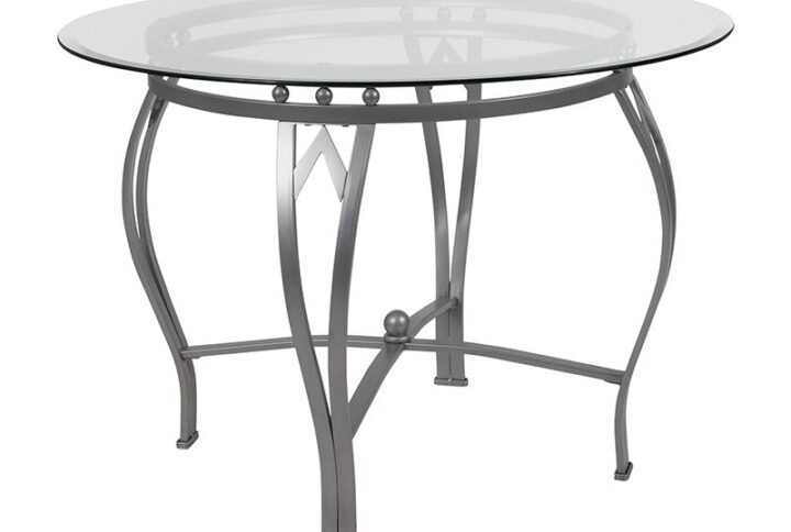 Building the perfect dining room is easier when you have a great foundation. Starting with an exquisite ornamental pedestal base this 42" glass topped dining table is off to a phenomenal start. Crowned by a round