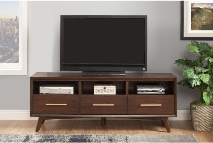 The streamlined design of the Gramercy mid-century TV Console creates a stunning focal point in your space. The clean lines