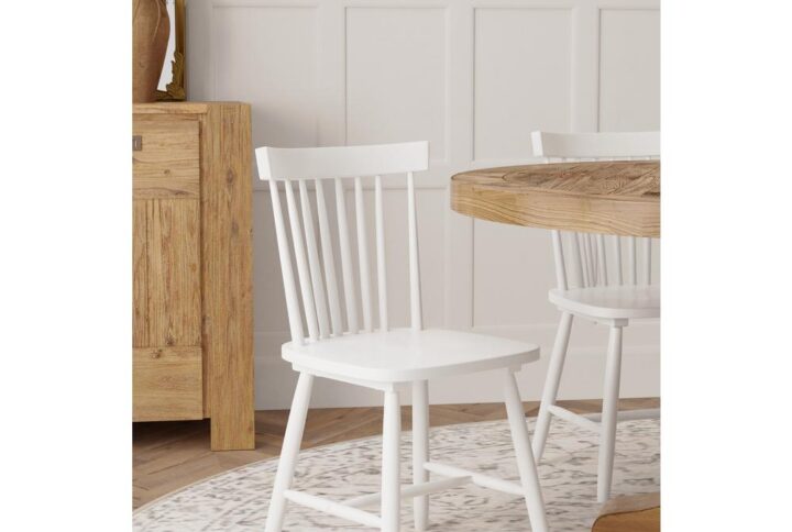 Add style to your room with the Alpine Furniture Lyra wood dining side chairs.  Available in a classic white or black finish.   The Lyra side chairs are constructed using Rubberwood solids.   A spindle back design adds to the beauty of this chair.  Item comes as a set of 2 chairs.