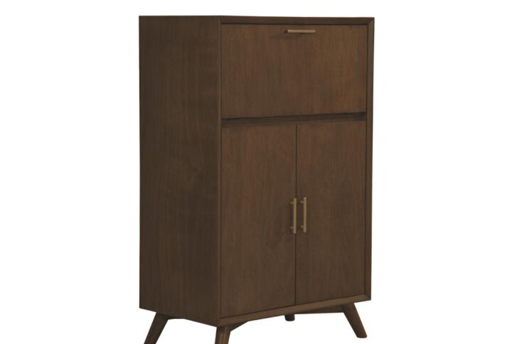 The Flynn Bar Cabinet is the perfect storage solution for mixing and serving beverages. It features a pull-down tray and two levels of storage for liquor bottles and wine glasses. Its sleek
