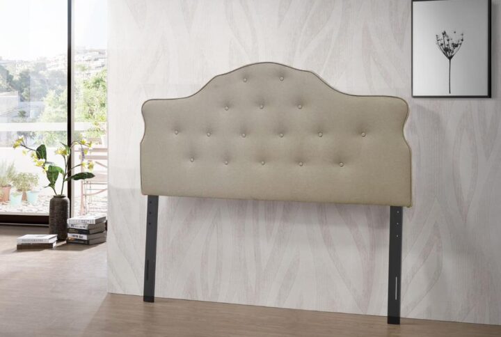 This queen size tufted headboard in a very stylish arch curved design will instantly provide a sophisticated look to your room. It features an adjustable height from 47 inches for up to 62 inches. It is covered in a durable polylinen fabric for everyday use.