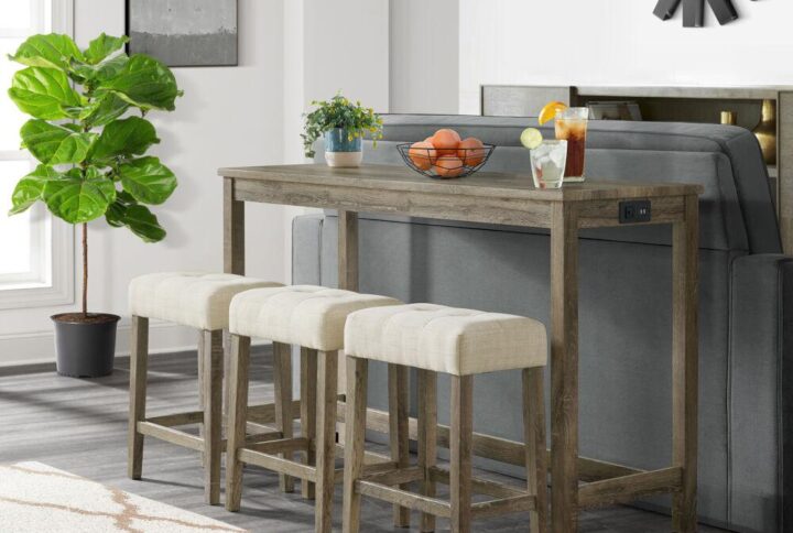 Step into the enchanting world of rustic modern living with the Wyeth Dining 4-piece bar set by Cambridge! This ensemble boasts a counter-height table and three oh-so-comfy upholstered stools