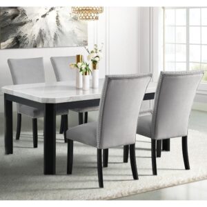 Dine in luxury with the Solano Dining 5-piece set by Cambridge. This modern contemporary dining set serves any occasion from a casual lunch in an elegant breakfast nook to a family dinner in your formal dining room. The white marble tabletop features beveled corners and natural veining - no two are exactly alike! Foam-filled chair backs and seats covered in soft gray velvet are finished with chrome nailhead detailing. Ebony black wood frames offer striking contrast for a bold statement. Crafted from solid Acacia and rubberwood