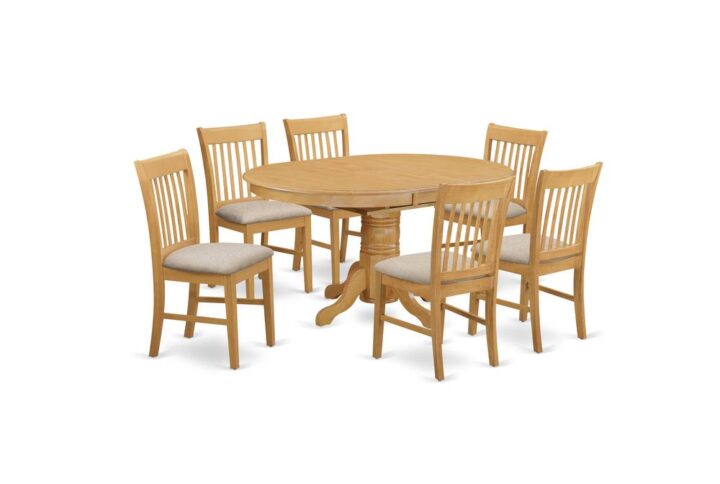 The whole 7-piece Dining table set material is wood with a perfect Oak finish; the kitchen chairs offer classy carvings with Linen upholstery providing sufficient support. The dinette table set is a 7-piece set of spectacular kitchen table with a stronger carved pedestal support. The Beveled oval table completes with four long lasting kitchen dining chairs that create cozy and comfortable kitchen space environment.