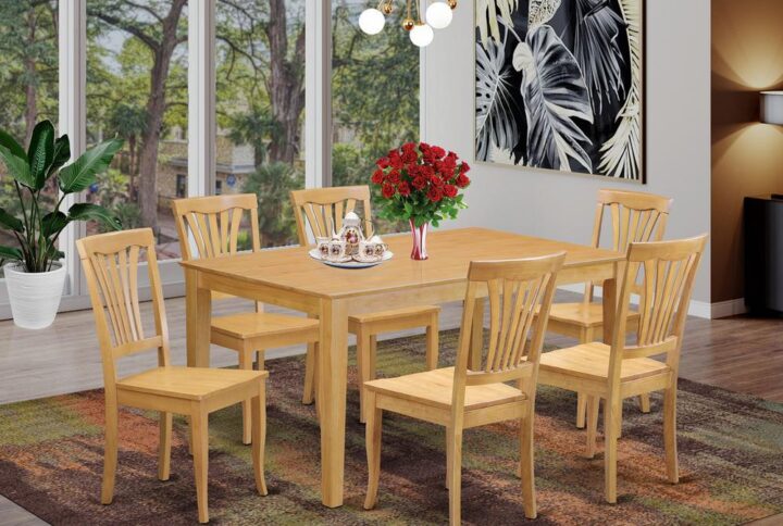 This amazing simple but lovely 7 piece dinette table set will bring warmth and style to your dining room. It contains a dinette table and 6 beautifully crafted dining room chairs. The Dinette set can seat a maximum of six people. This set is designed out of the popular Asian Hardwood