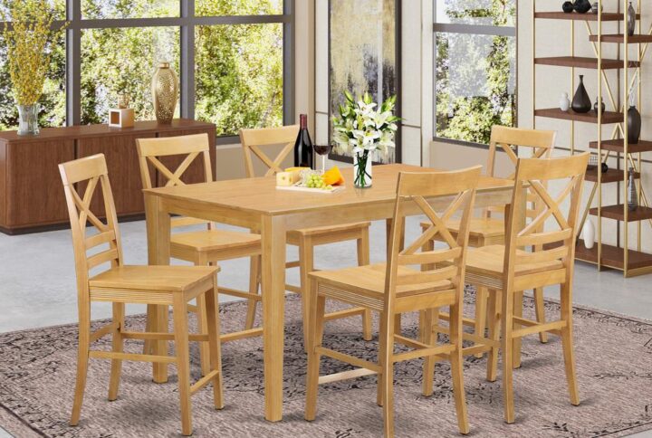 Beautify your kitchen or counter height with our contemporary premium Rubberwood table and chairs set generated for long-lasting use. This Counter Height set comes in a rich Oak finish. The formal Counter height setincludes 1 small kitchen table and six armless counter height chairs. The table comes with a Bevel-shaped top with four legs at each corner and without leaf. Each chair has four legs at each corner linked together and comes with a distinctively simple wooden surface. The whole set is a combination of simpleness and traditional style. It’s very easy to sustain and can readily blend with many decors.