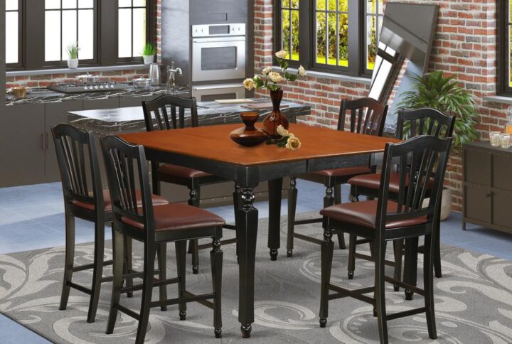 This counter height dining table set is highlighted by an eye-catching Black finish and faux leather seats. The square pub table stores an easily accessible butterfly leaf extension to expand the counter height table top space and fold and hide itself away to save valuable space. The well produced bar stools with backs feature style and comfort with stunning fluted legs and accommodating stretchers designed for footrests. The particular slat back counter height chairs are excellent to loosen up and enjoy your meal. This pub table set will enhance the dining area surrounding it and it will become the center of each social engagement that you will have in your home.