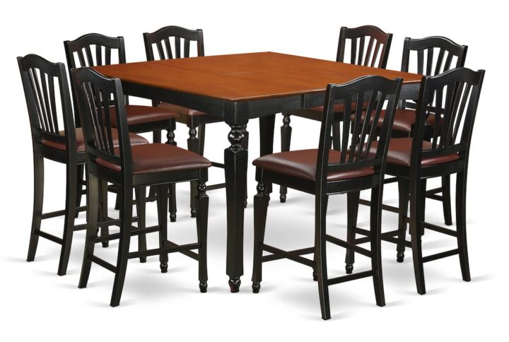 This counter height dining table set is highlighted by an eye-catching Black finish and leather seat. The square counter height dining table stores an accessible expansion leaf extension to extend the pub table top space and fold and hide away to help save valuable space. The well crafted bar stools with backs feature elegance and comfort with charming fluted legs and accommodating stretchers designed for footrests. The slat back bar stools are definitely excellent to relax and really enjoy your meals. This counter height table and chairs set will improve dining area surrounding it and it will become the focus of every family engagement that you have in your home.