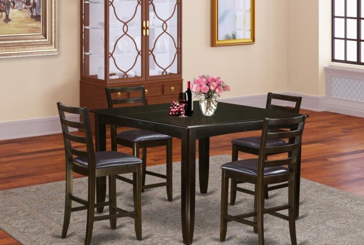 Counter height pub sets provides a traditional style that has square counter height dining table and bar stools which feels at home either in a functioning kitchen area or standard dining-room. Table and chairs have a luxurious stylish look combined with beveled edges. Pleasantly seat your friends and relatives with the table built-in self storage expansion leaf. Square pub table is mounted on four dependable corner posts for plenty leg room. Kitchen bar stool have ladder back styling along with sleek and relaxing padded seats. Finished in rich Cappuccino color.