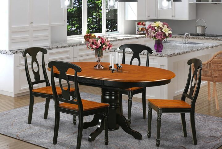 This oval exquisite small table sets match up with any sort of dining room with rich accents and complicated style. These kind of Kenley small kitchen table set boasts fascination and nice style for a cozy and relaxed sense with a simple touch of class. Well-designed dining room table set is finished in lavish Black & Cherry. Oval small kitchen table with easy to use 18” extendable leaf for additional guests when needed. Wonderful Napoleon style dinette chairs with synthetic leather seats or wood seat. Dining room chair seat in either wood or faux leather to fit preference and desired theme.