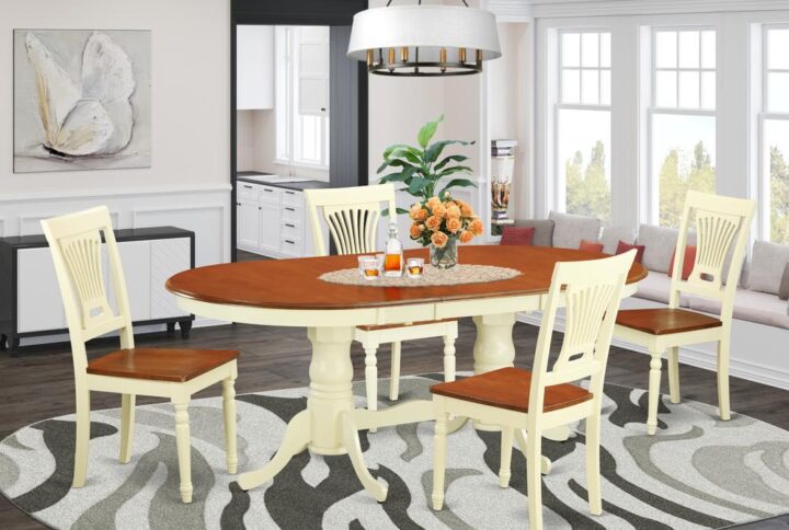 The Plainville table set features a breathtaking finish which has a countryside laid-back impression. Joining together the simple care of a simple hardwood dining room table top with timeless styled legs for that personalised look. The streamlined oval dining table top