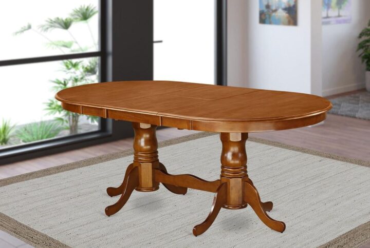 The dining room table with built-in self storage butterfly leaf which fits 4 to 8 persons.Dazzling hardwood table top with well-built carved pedestal support. Beveled oval shape to make welcoming kicthen space ambiance and finished in rich Saddle Brown