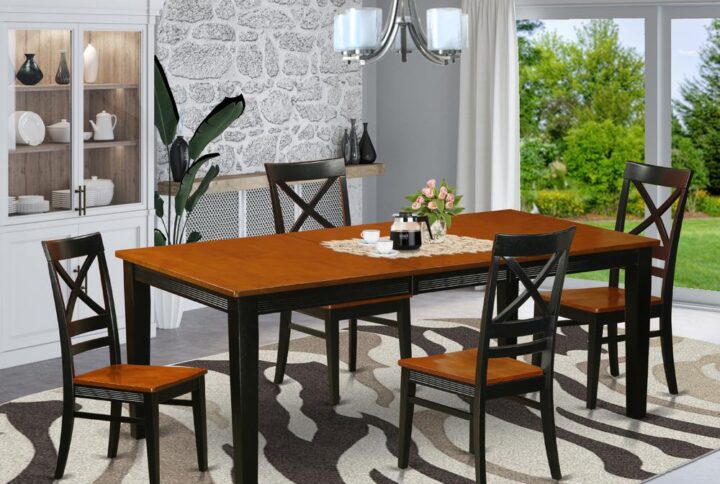 Contemporary four legged table and chairs set for dining room or eat in kitchen space. Two tone rectangle-shaped small dining table with brown top and Black legs. High back dinette chair with gentle curves