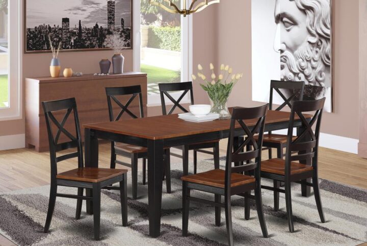 Contemporary four legged table set for dining room or eat in kitchen space. Two tone rectangular small table with brown top and Black legs. High back kitchen dining chairs with soft curves