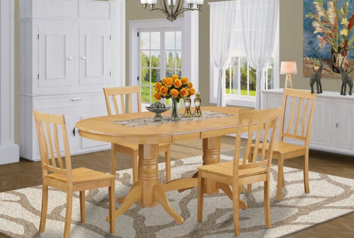 This excellent dining room table set includes a long oval shaped kitchen table that has 2 pedestals. This modern day looking set has 4 seats and therefore has an optimal seating capacity of 4 persons. The product has a pleasant